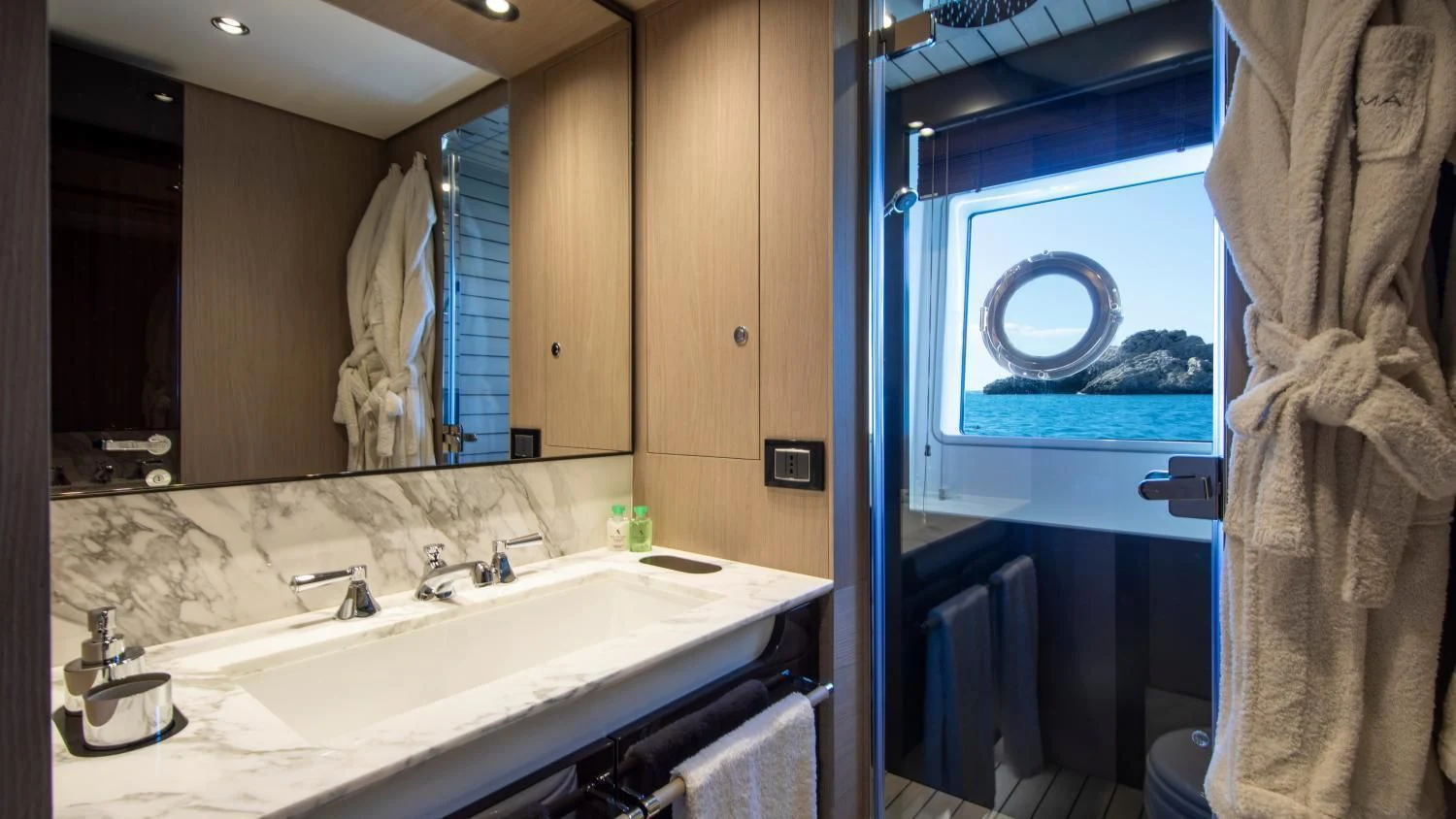 a bathroom with a large mirror aboard CLOUDY BAY Yacht for Sale