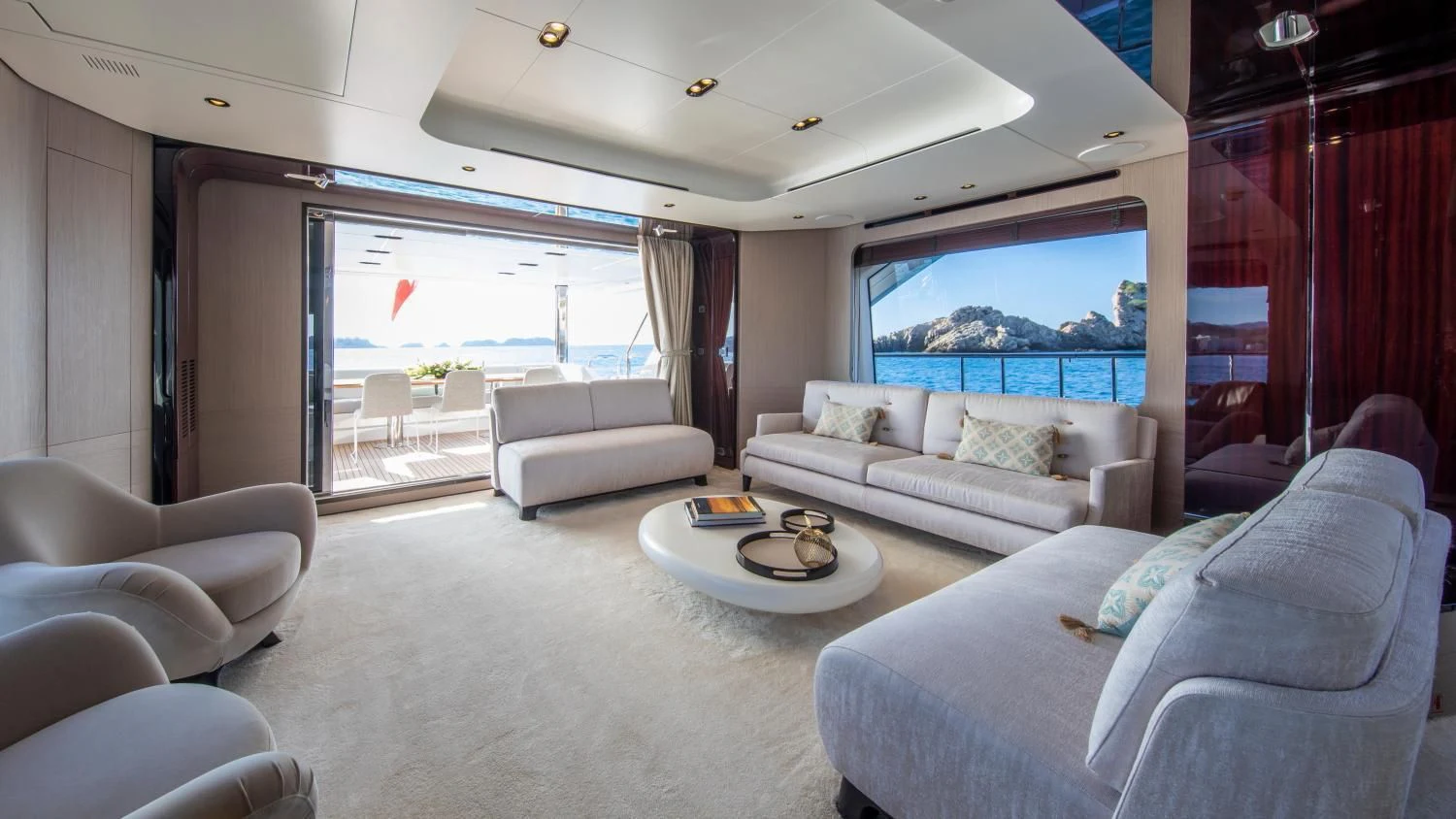 a living room with a large window aboard CLOUDY BAY Yacht for Sale