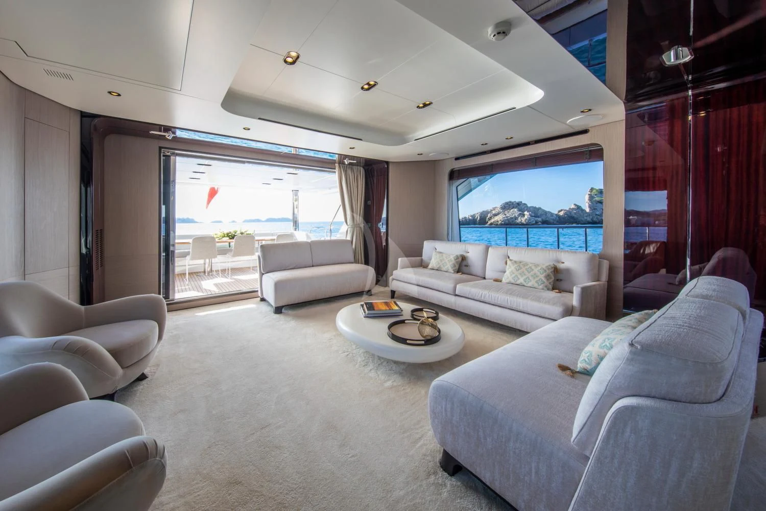 a living room with a large window aboard CLOUDY BAY Yacht for Sale