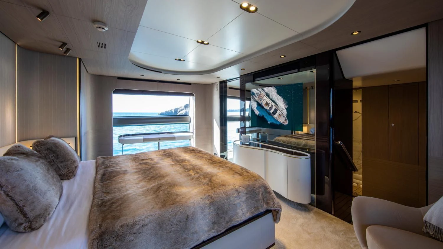 a bedroom with a bed and a television aboard CLOUDY BAY Yacht for Sale