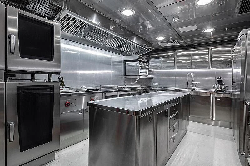 a large kitchen with stainless steel appliances aboard HODOR Yacht for Charter