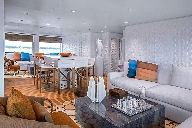 a living room with a large window aboard HODOR Yacht for Charter
