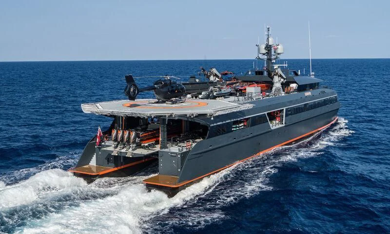 a large ship in the water aboard HODOR Yacht for Charter