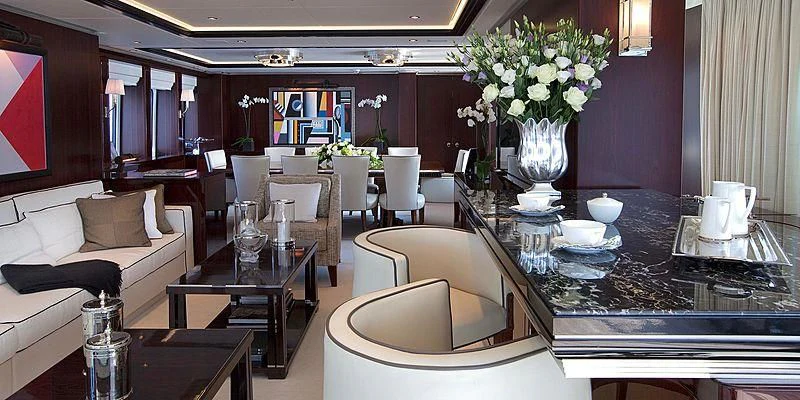 a large room with a table and chairs aboard AILISH V Yacht for Sale