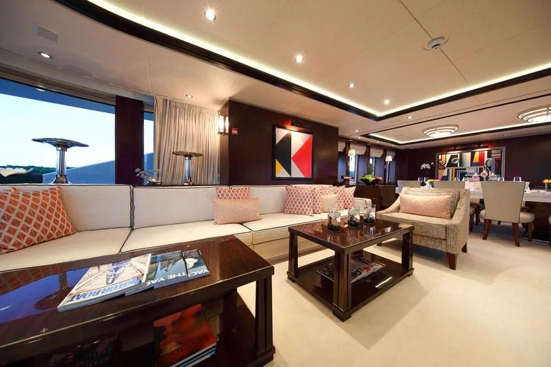 a living room with a couch and a coffee table aboard AILISH V Yacht for Sale
