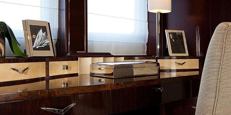 a room with a desk and a lamp aboard AILISH V Yacht for Sale