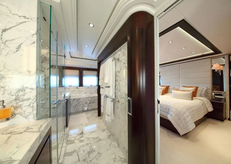 a room with a bed and a mirror aboard AILISH V Yacht for Sale