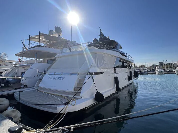 a boat docked at a pier aboard PIOLA Yacht for Sale