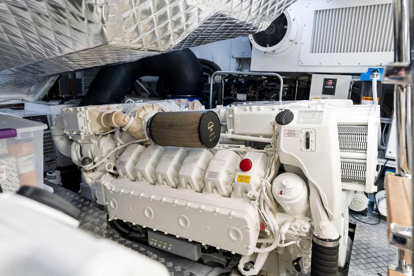 a machine with a large metal pipe aboard PERSHING 7X Yacht for Sale