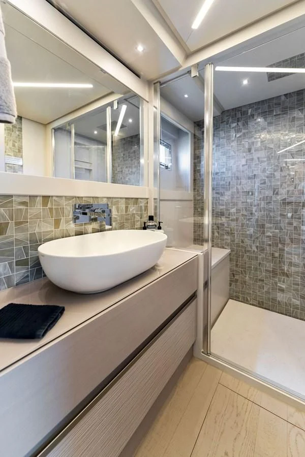 a bathroom with a large mirror aboard PERSHING 7X Yacht for Sale