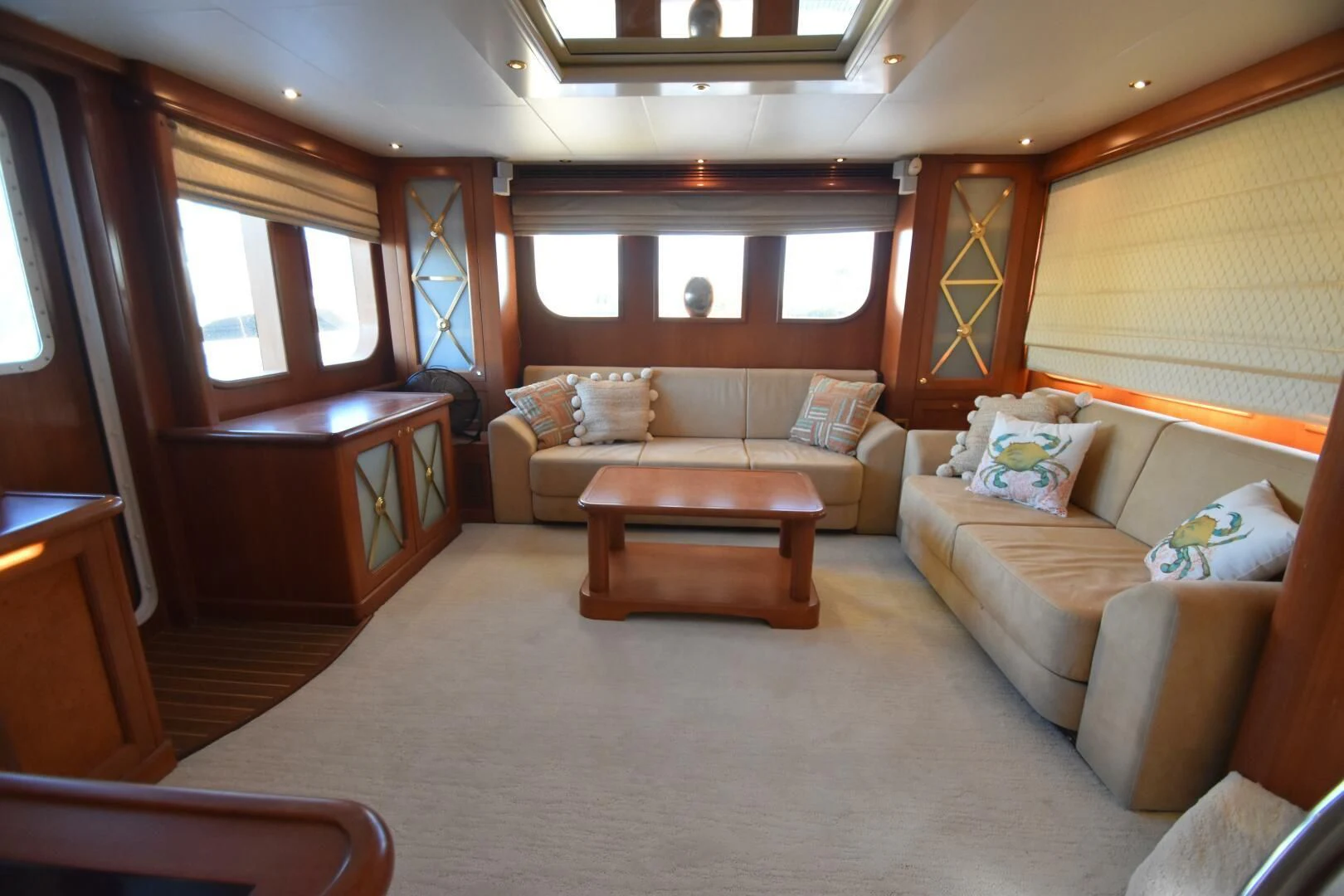 a living room with a couch and a table aboard BLUE SEAS Yacht for Sale