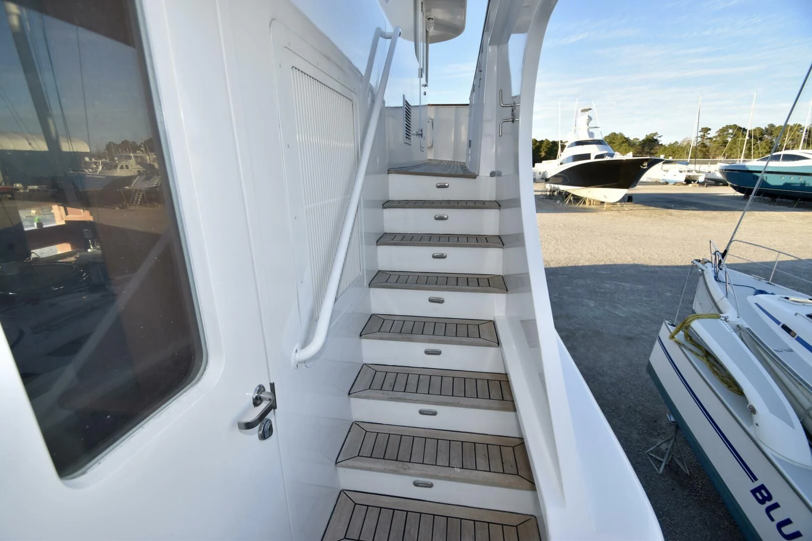 a white boat with a door open aboard BLUE SEAS Yacht for Sale