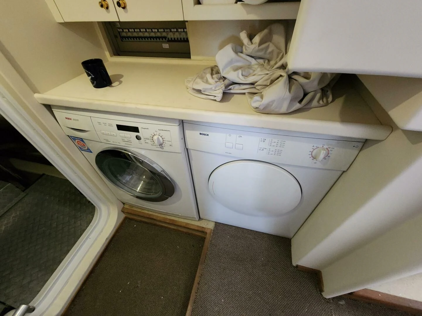 a washer and dryer in a laundry room aboard BLUE SEAS Yacht for Sale