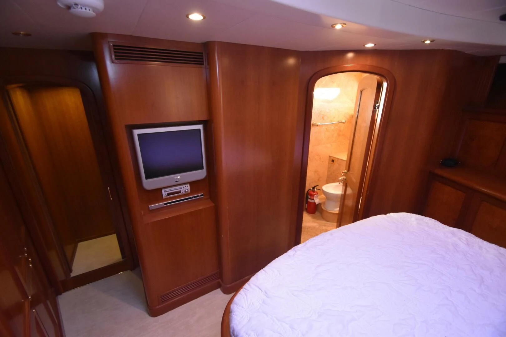 a bedroom with a tv and a bed aboard BLUE SEAS Yacht for Sale