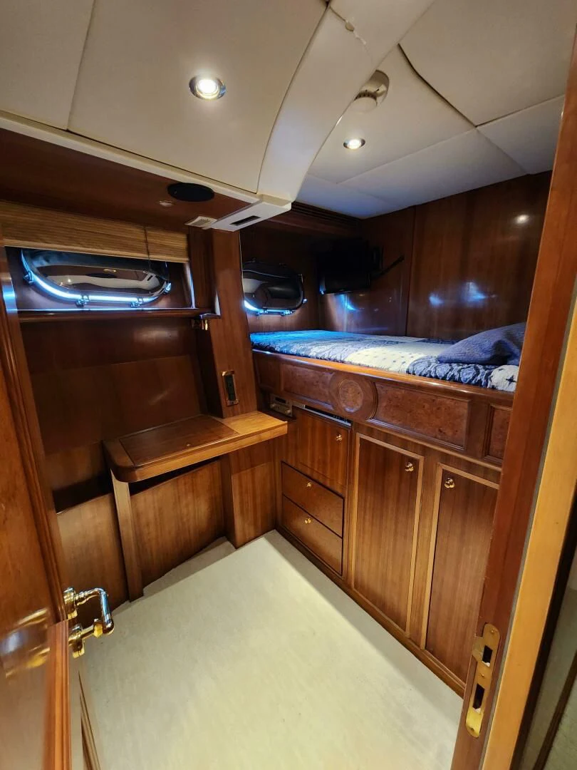 a bedroom with a bed and a closet aboard BLUE SEAS Yacht for Sale