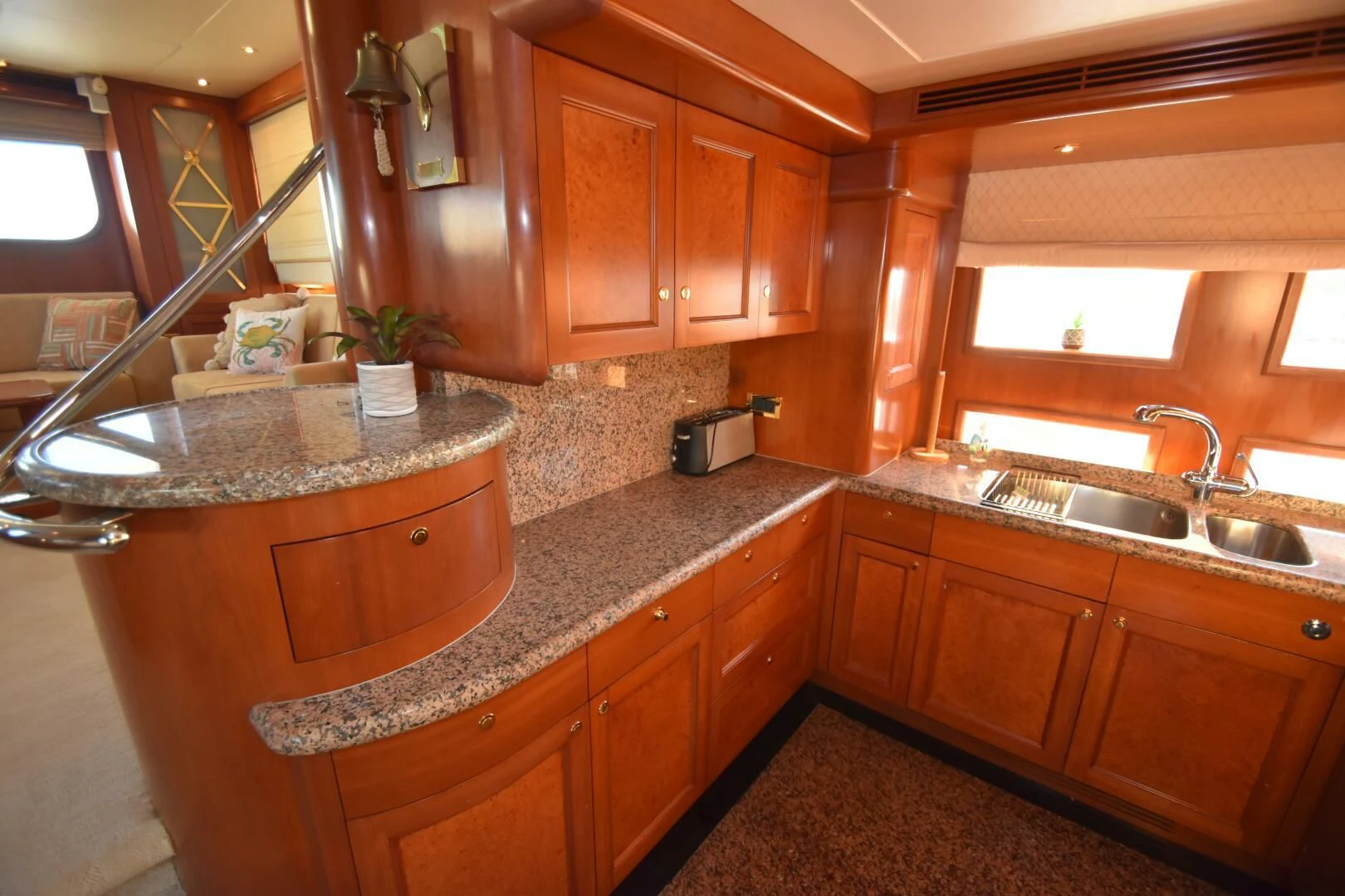 a kitchen with wooden cabinets aboard BLUE SEAS Yacht for Sale