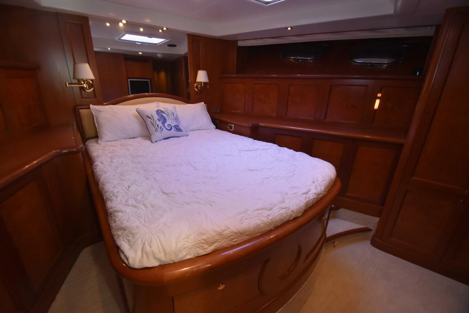 a bed with a white comforter aboard BLUE SEAS Yacht for Sale