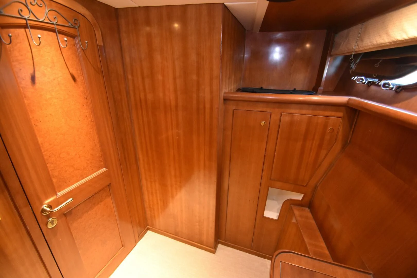 a room with wooden cabinets aboard BLUE SEAS Yacht for Sale