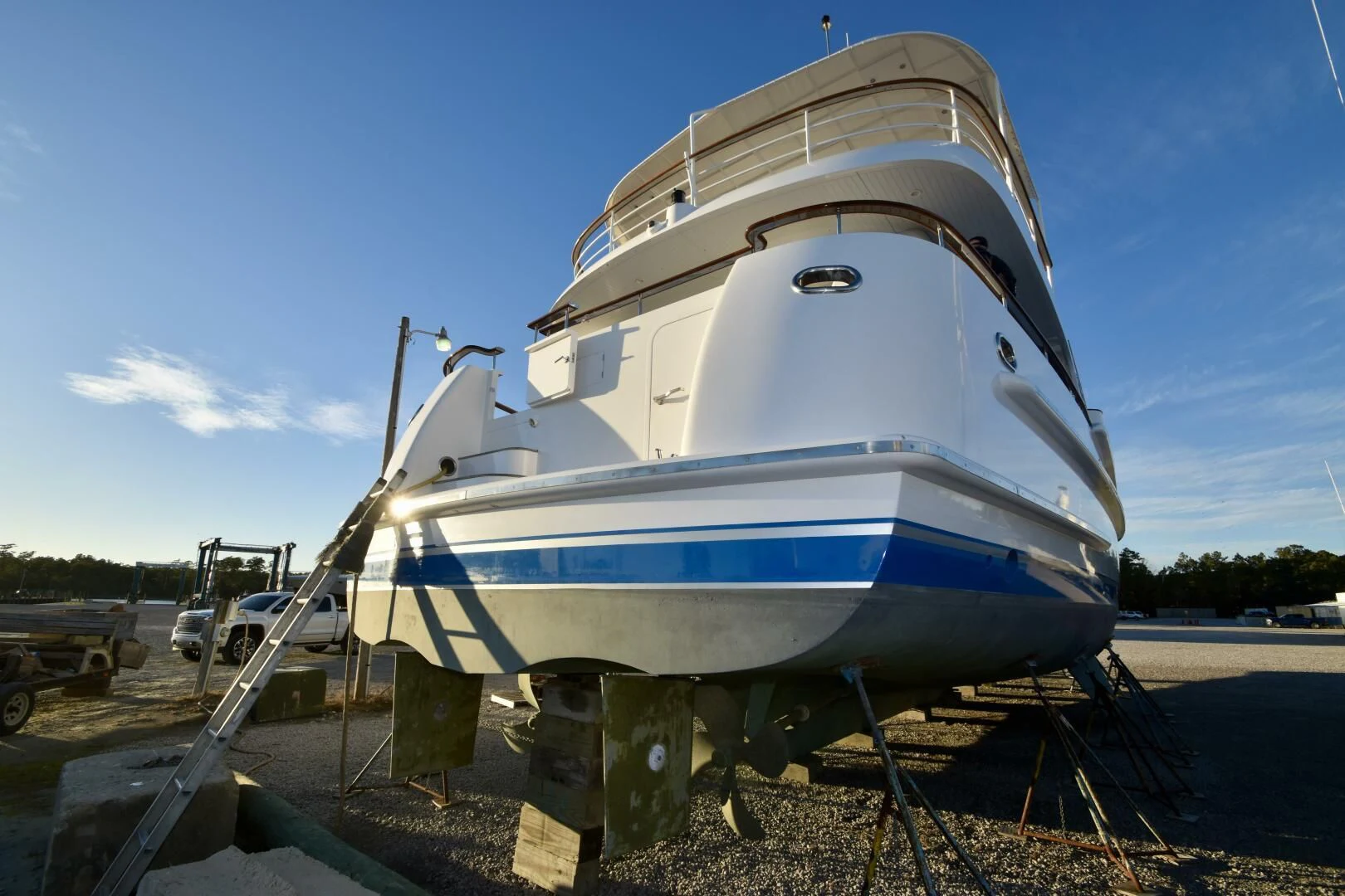a boat on a trailer with Theme Building in the background aboard BLUE SEAS Yacht for Sale