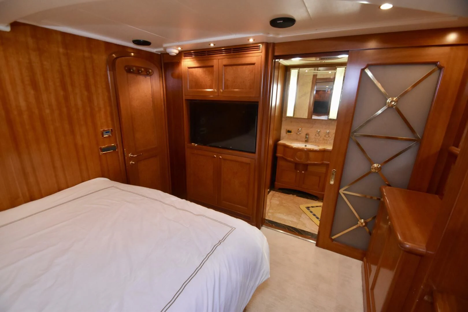 a bedroom with a bed and a closet aboard BLUE SEAS Yacht for Sale