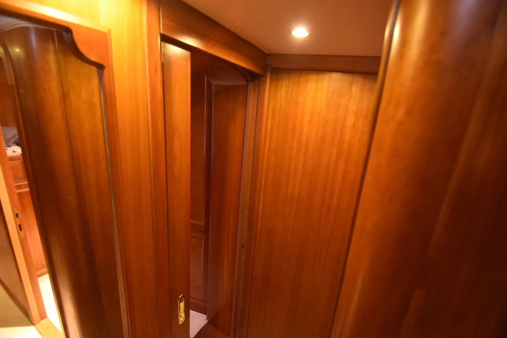 a room with wooden cabinets aboard BLUE SEAS Yacht for Sale