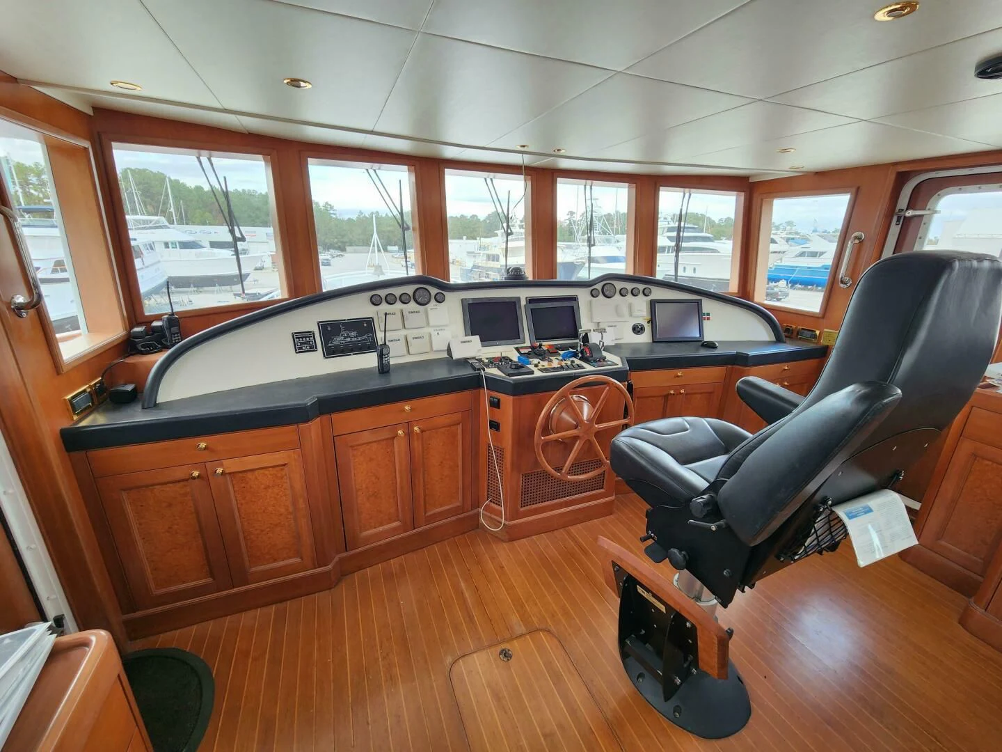 a room with a leather chair and a desk with a computer on it aboard BLUE SEAS Yacht for Sale