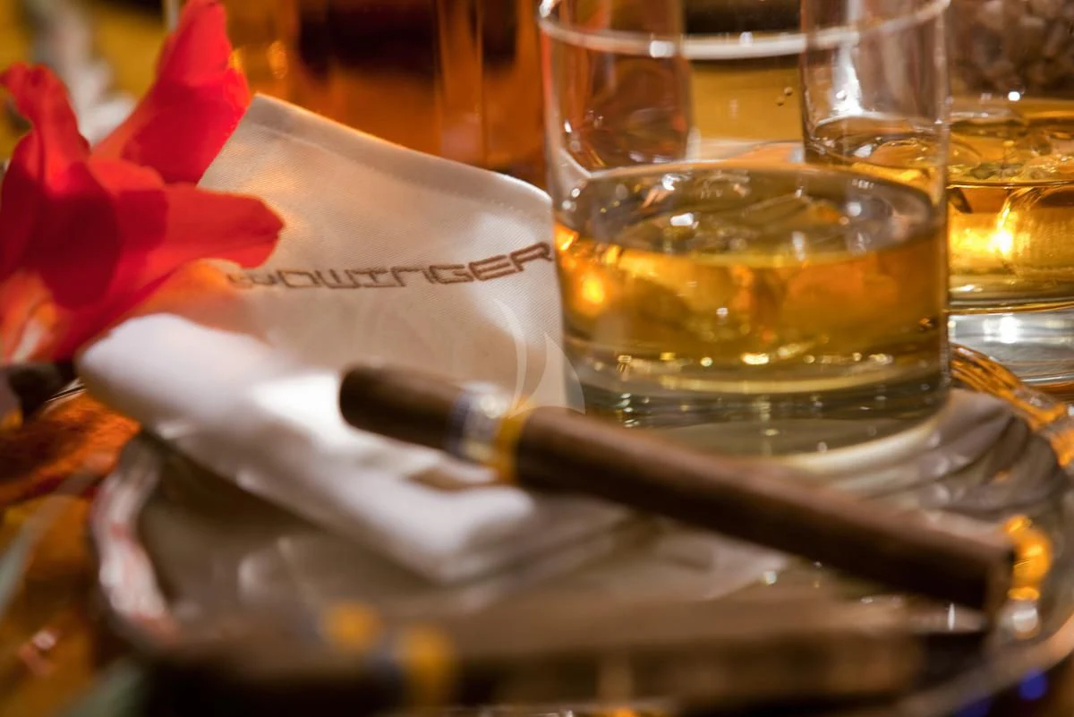 a book and a glass of wine aboard DWINGER Yacht for Sale