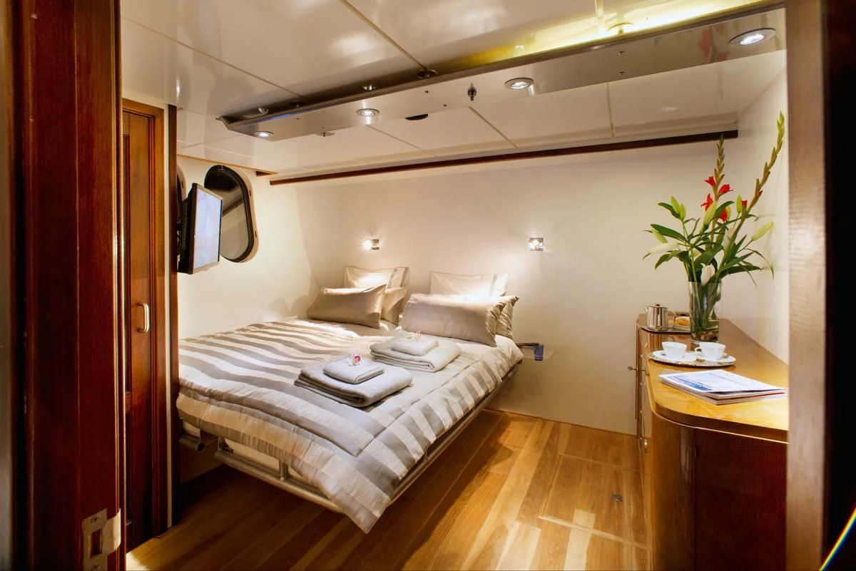 a bed in a room aboard DWINGER Yacht for Sale