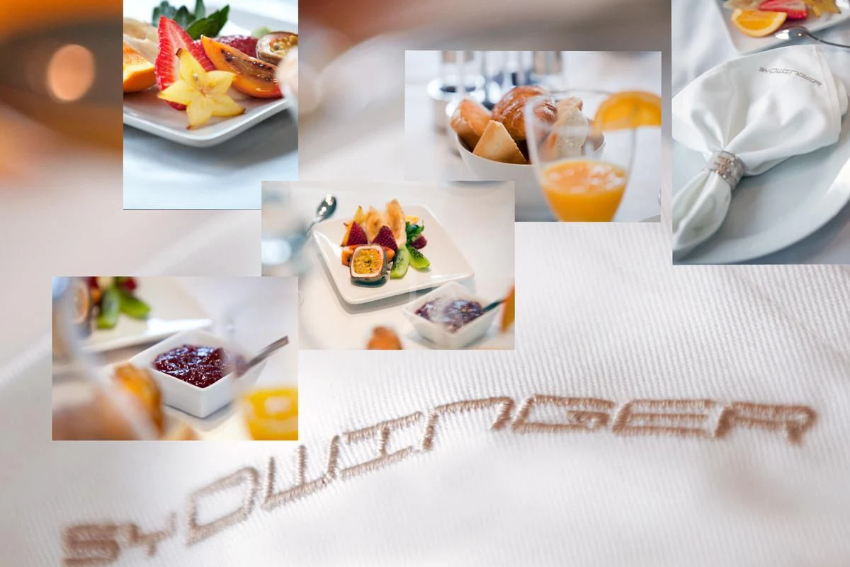 a table with food and drinks aboard DWINGER Yacht for Sale