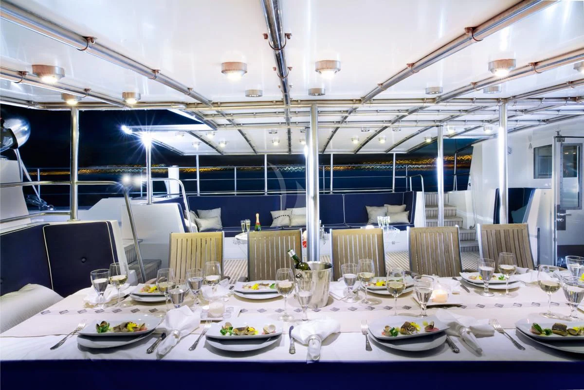 a table set for a dinner aboard DWINGER Yacht for Sale