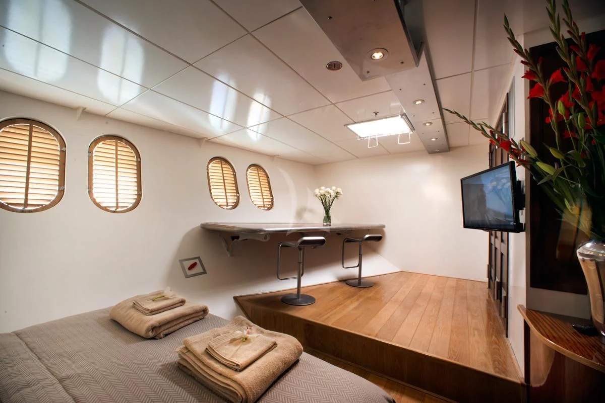 a room with a desk and a tv aboard DWINGER Yacht for Sale