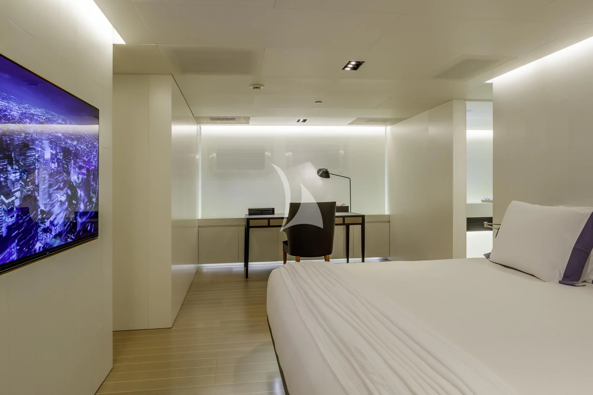 a room with a bed and a tv on the wall aboard BARACUDA VALLETTA Yacht for Sale