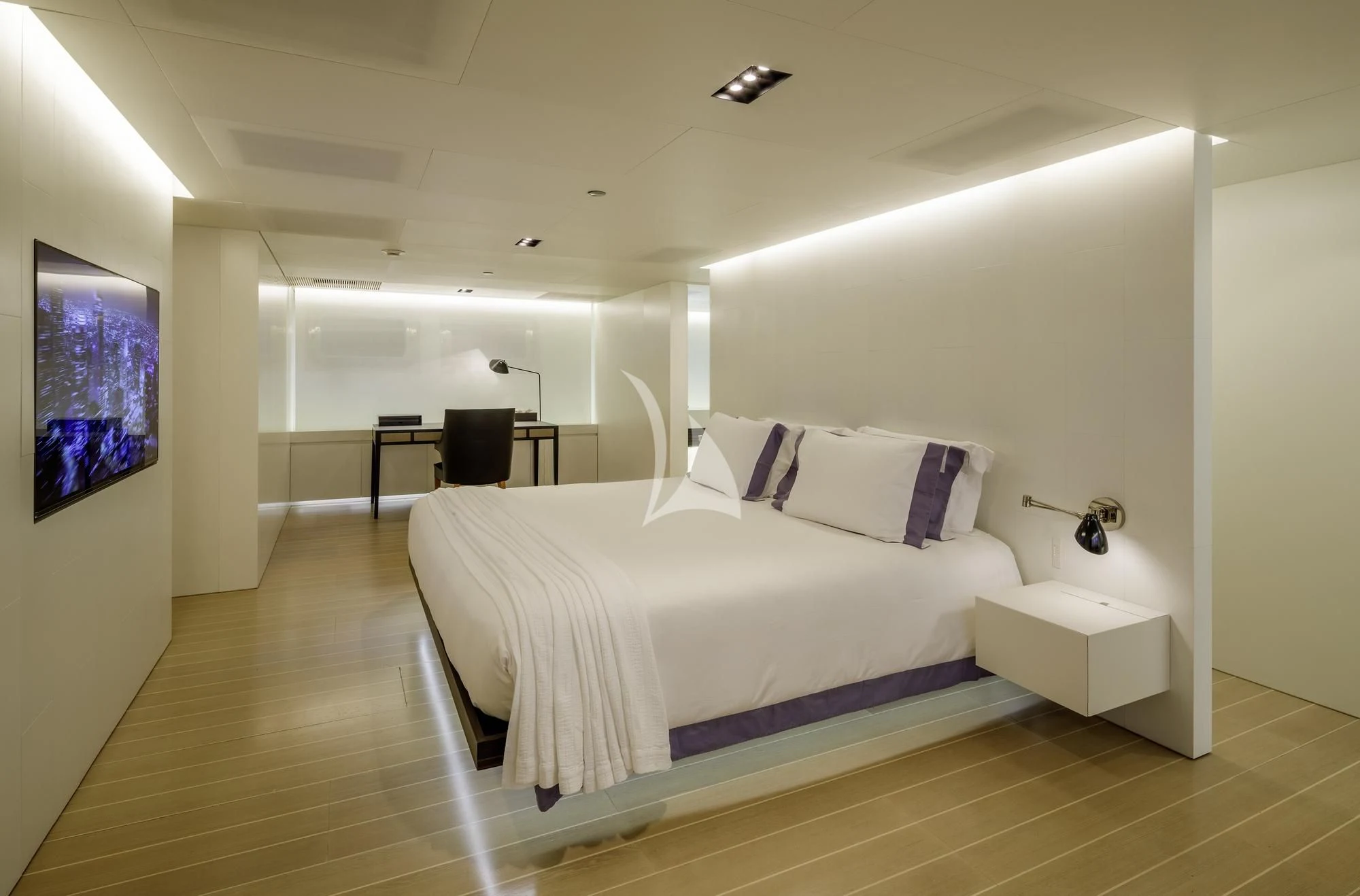 a room with a bed and a tv on the wall aboard BARACUDA VALLETTA Yacht for Sale