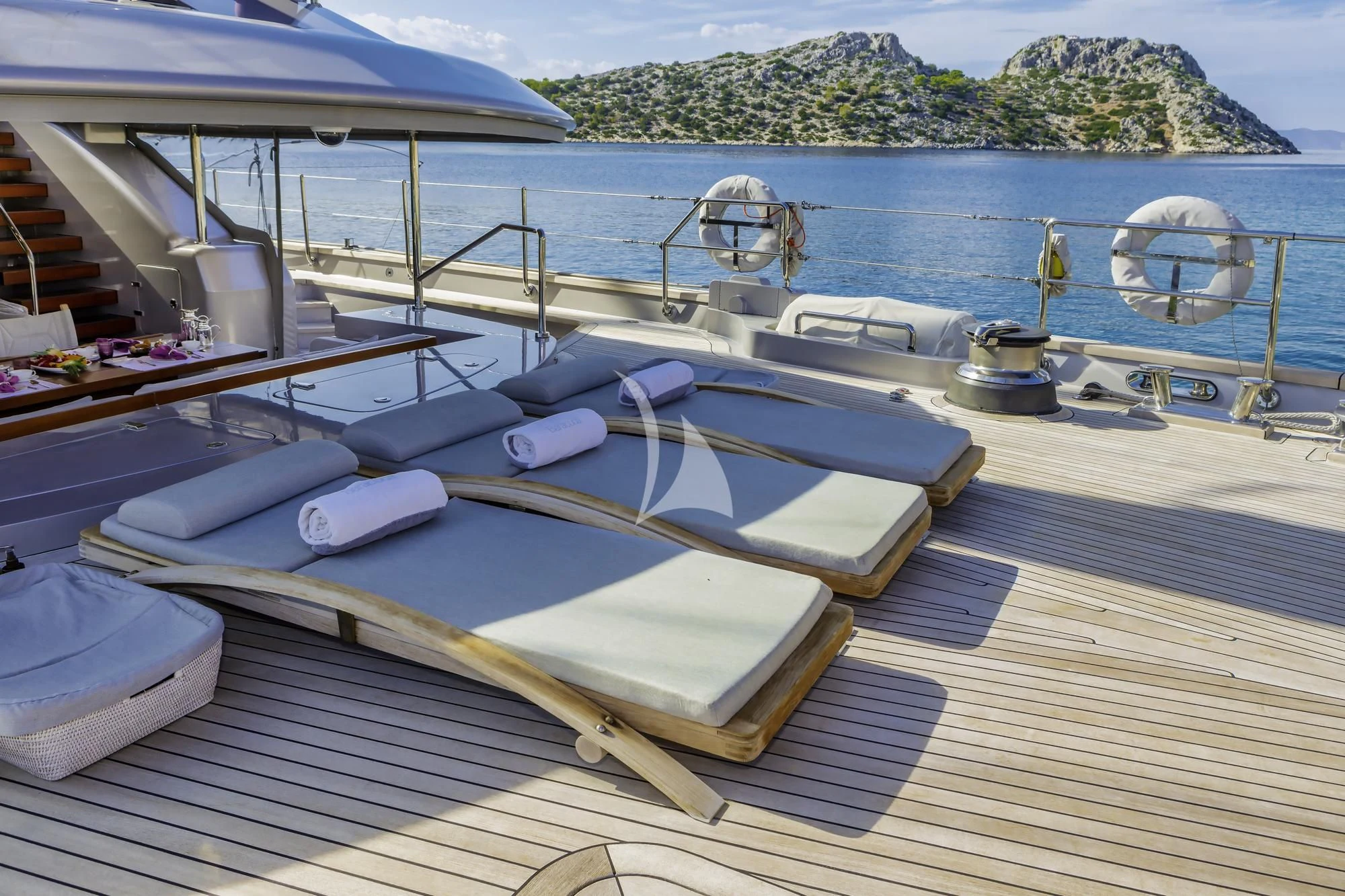 a deck with a boat and a fan on it aboard BARACUDA VALLETTA Yacht for Sale