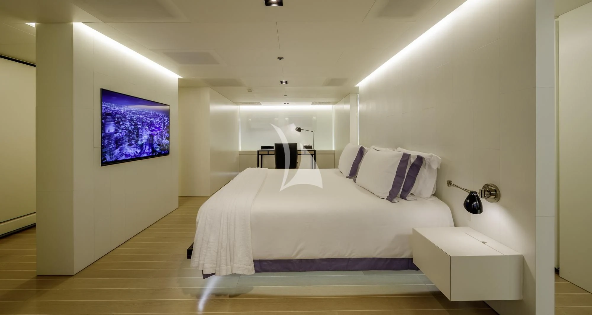 a room with a bed and a tv on the wall aboard BARACUDA VALLETTA Yacht for Sale
