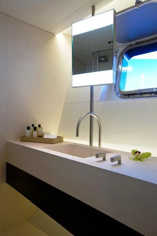 a bathroom with a sink and a mirror aboard BARACUDA VALLETTA Yacht for Sale