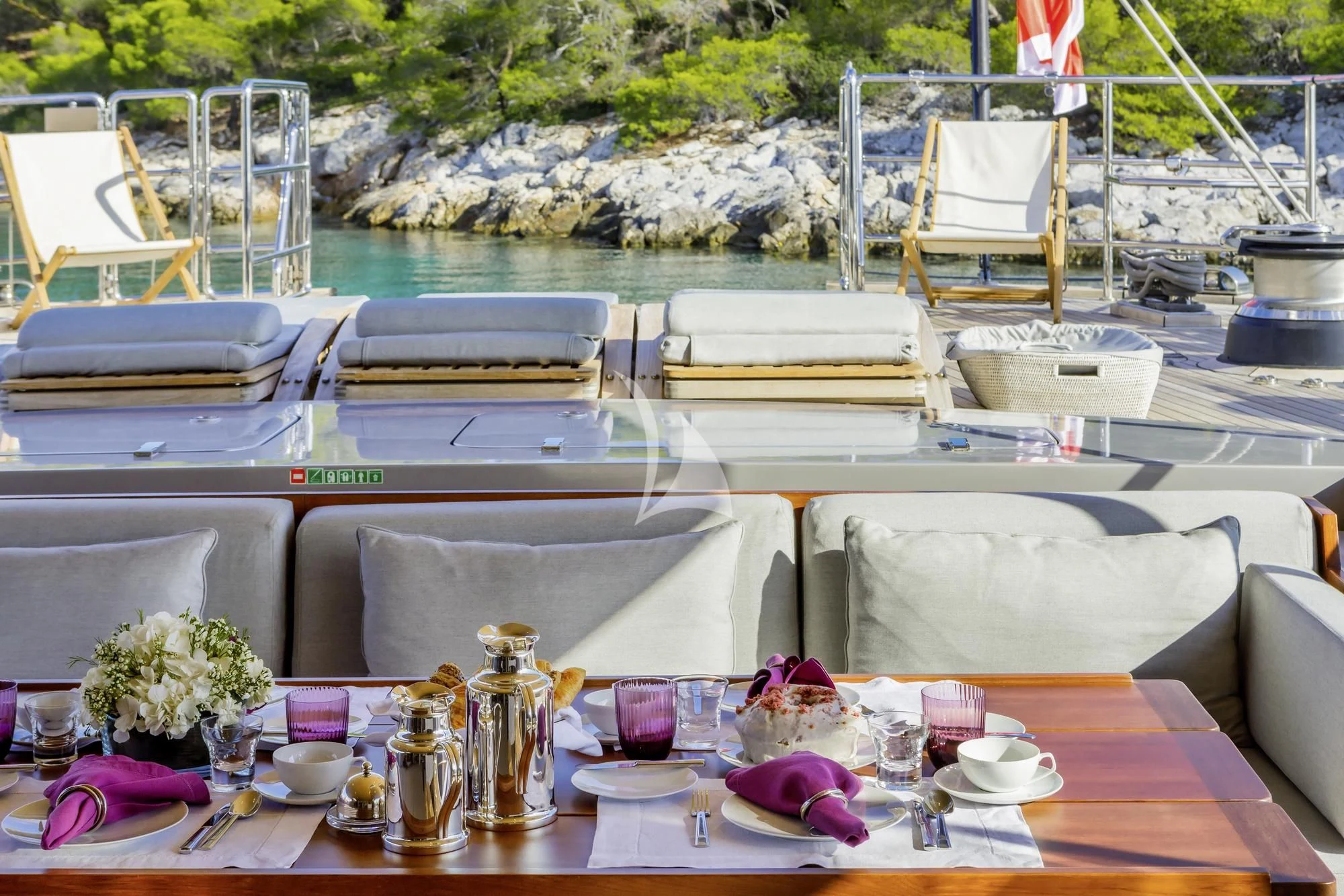 a table with chairs and tables aboard BARACUDA VALLETTA Yacht for Sale