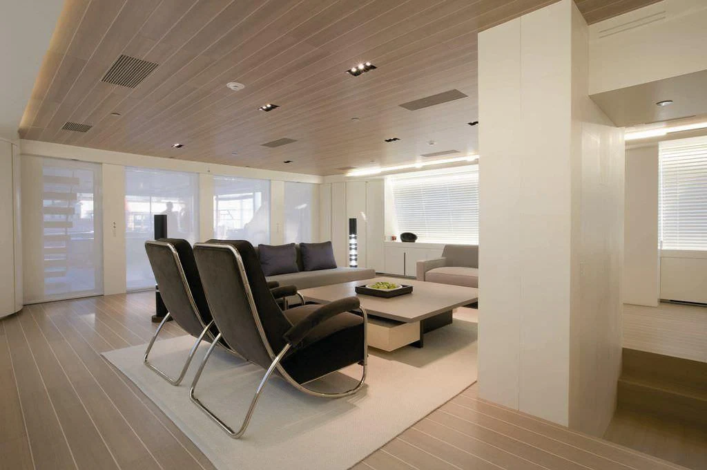 a room with a couch and a table aboard BARACUDA VALLETTA Yacht for Sale