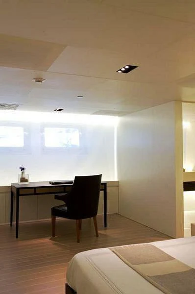 a room with a desk and a window aboard BARACUDA VALLETTA Yacht for Sale
