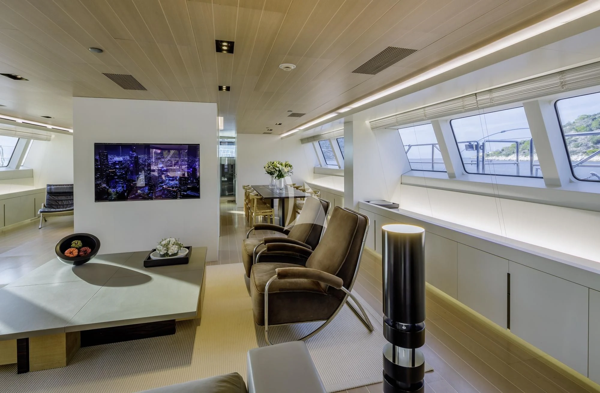 a room with a table and chairs aboard BARACUDA VALLETTA Yacht for Sale