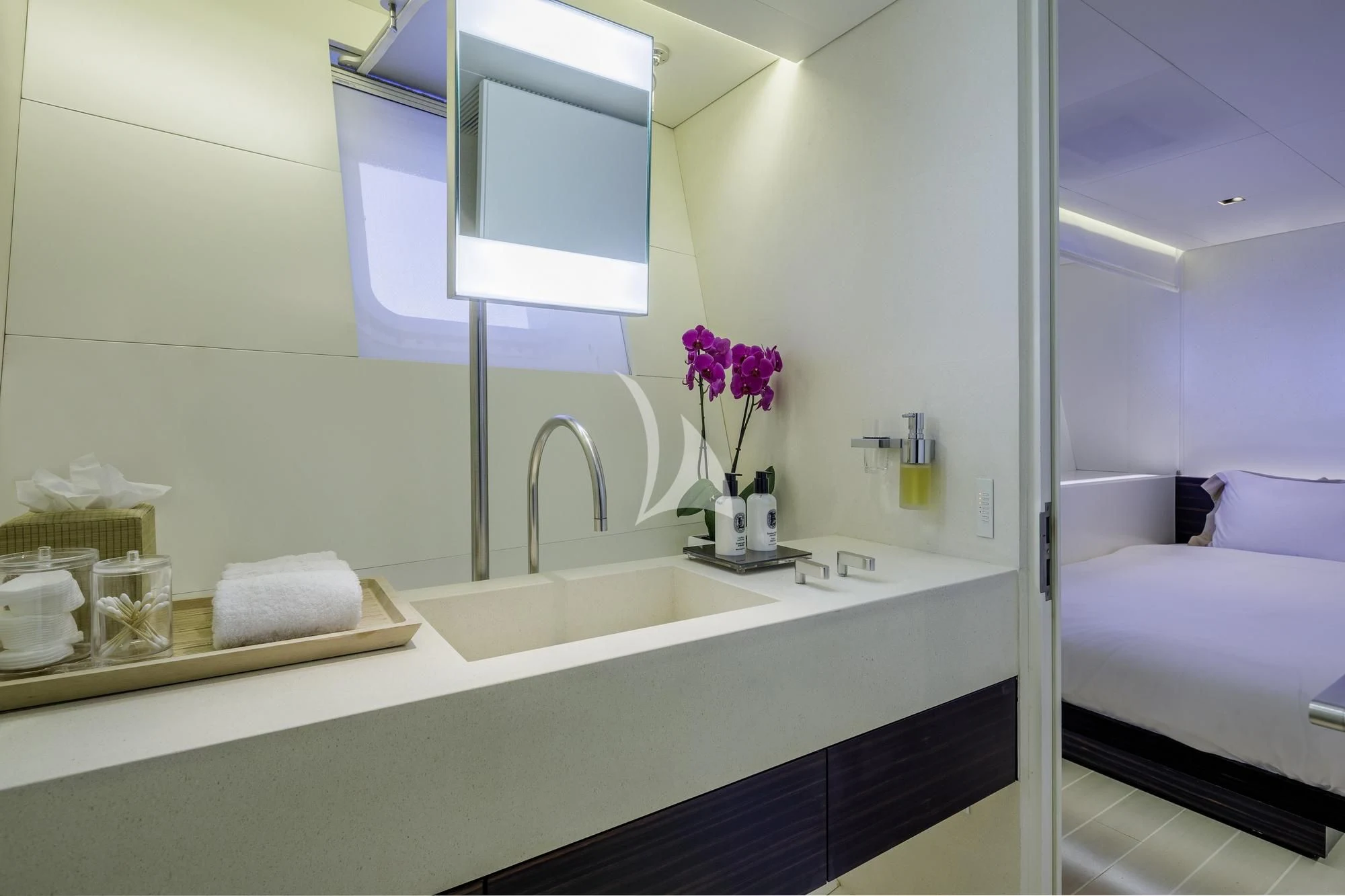 a bathroom with a sink and a bed aboard BARACUDA VALLETTA Yacht for Sale
