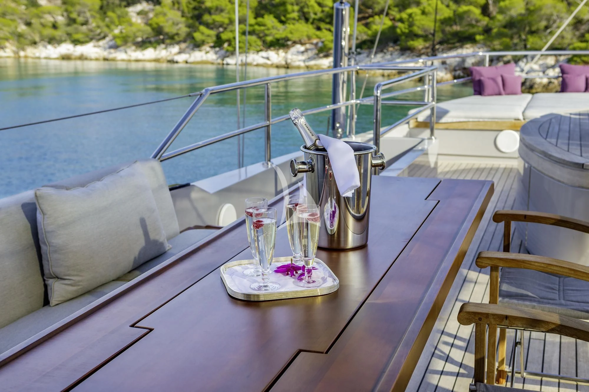 a table with glasses on it aboard BARACUDA VALLETTA Yacht for Sale