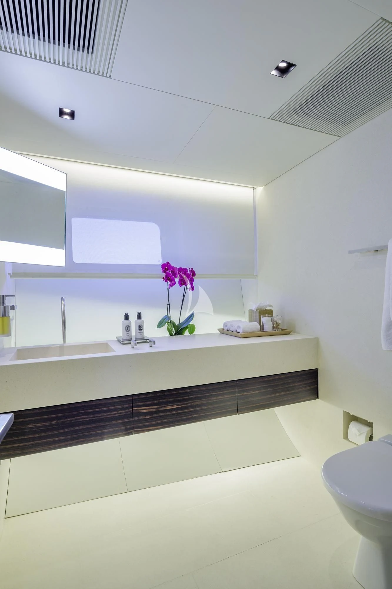 a bathroom with a sink and a mirror aboard BARACUDA VALLETTA Yacht for Sale