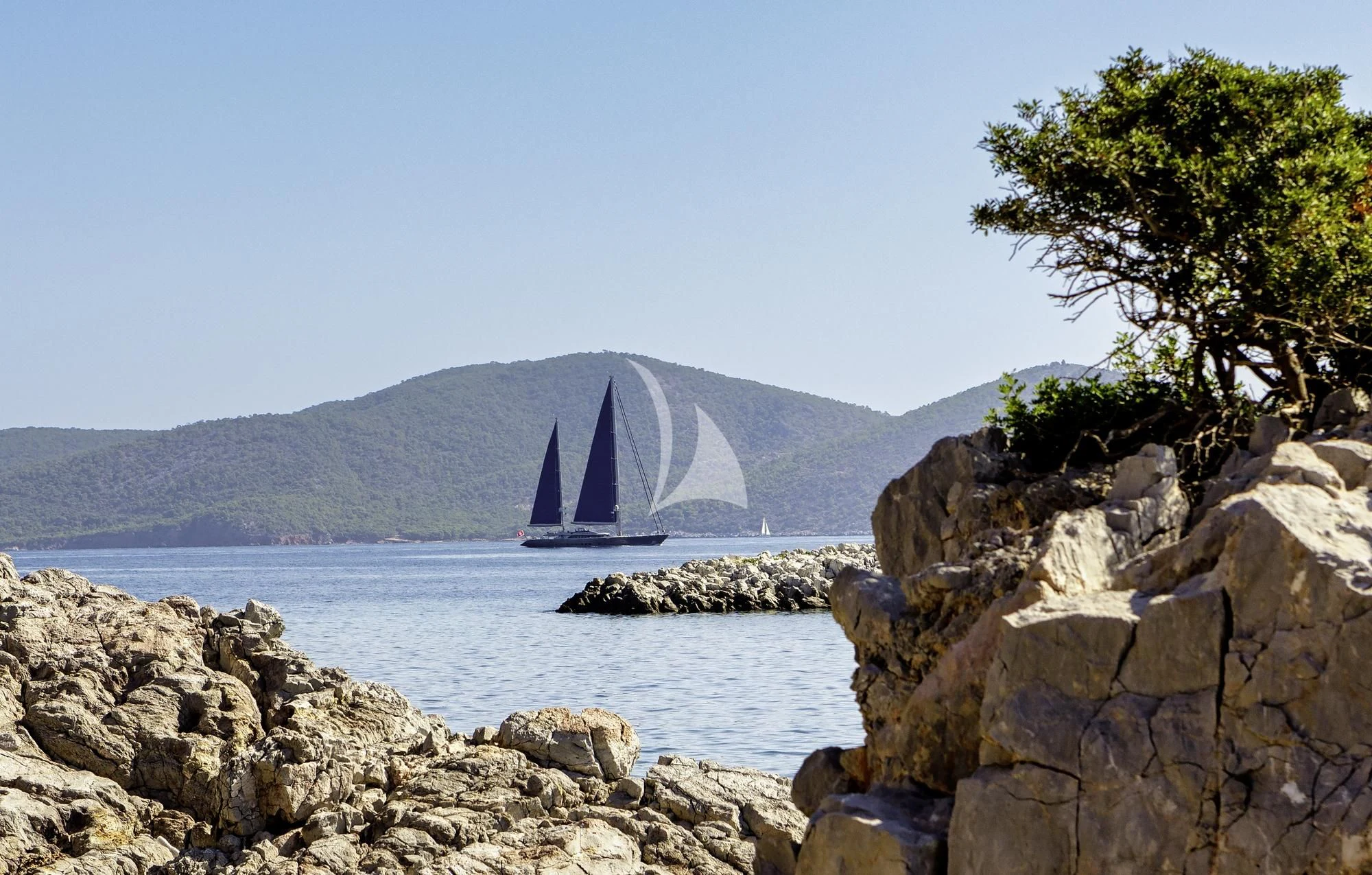 a body of water with a large waterfall in the background aboard BARACUDA VALLETTA Yacht for Sale