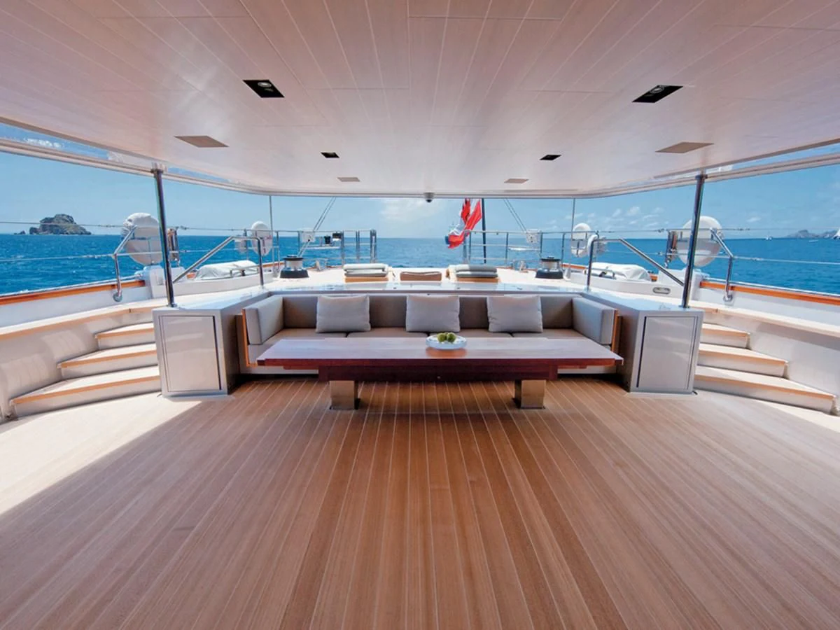 a room with a couch and a pool aboard BARACUDA VALLETTA Yacht for Sale