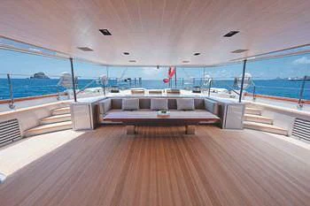 a room with a pool and deck aboard BARACUDA VALLETTA Yacht for Sale