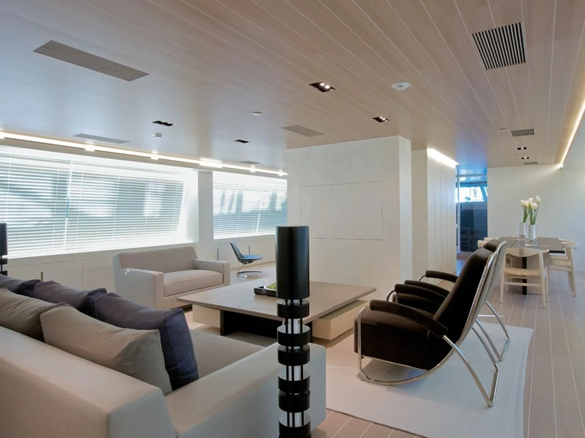 a room with a tv and a table aboard BARACUDA VALLETTA Yacht for Sale