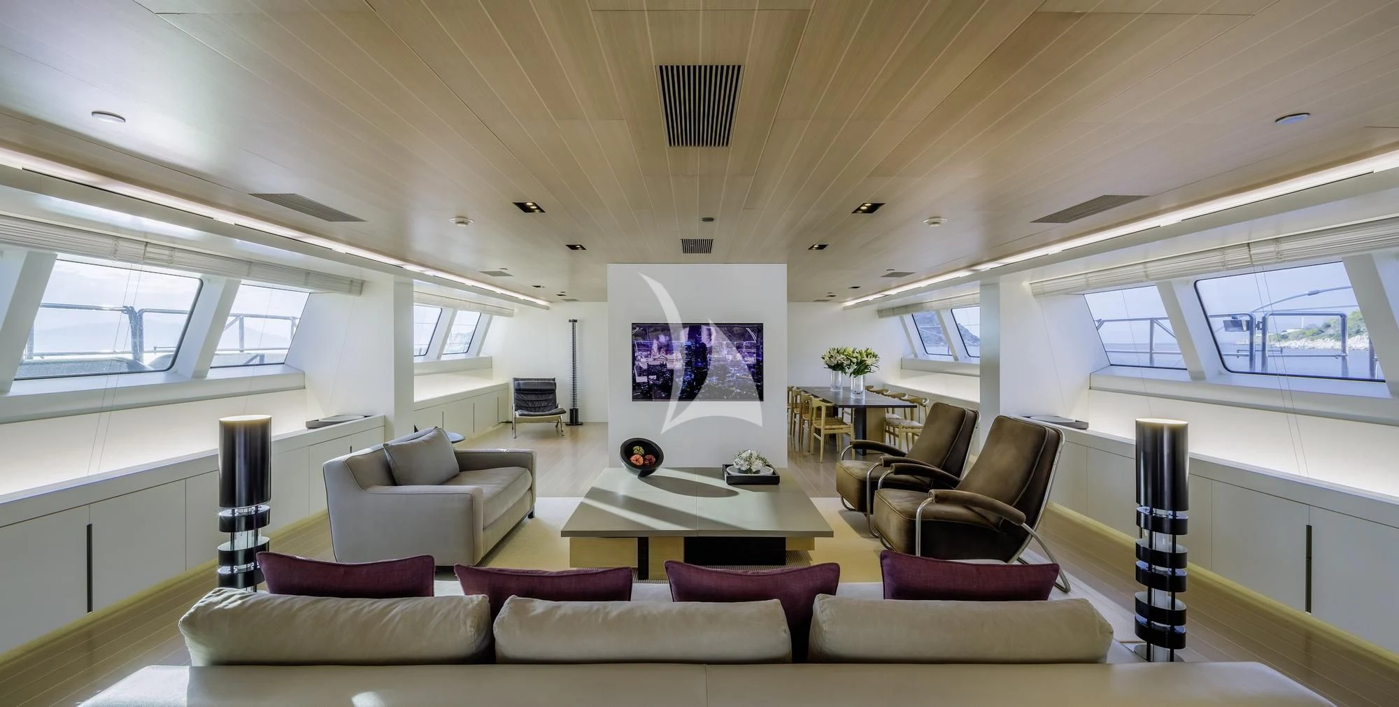 a living room with a large screen aboard BARACUDA VALLETTA Yacht for Sale