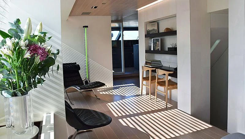 a room with a table and chairs aboard BARACUDA VALLETTA Yacht for Sale