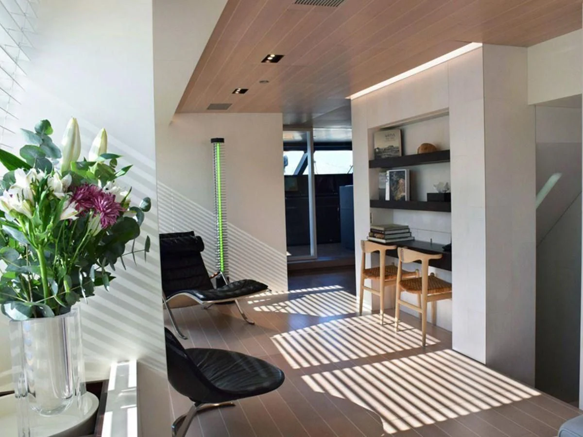 a room with a table and chairs aboard BARACUDA VALLETTA Yacht for Sale